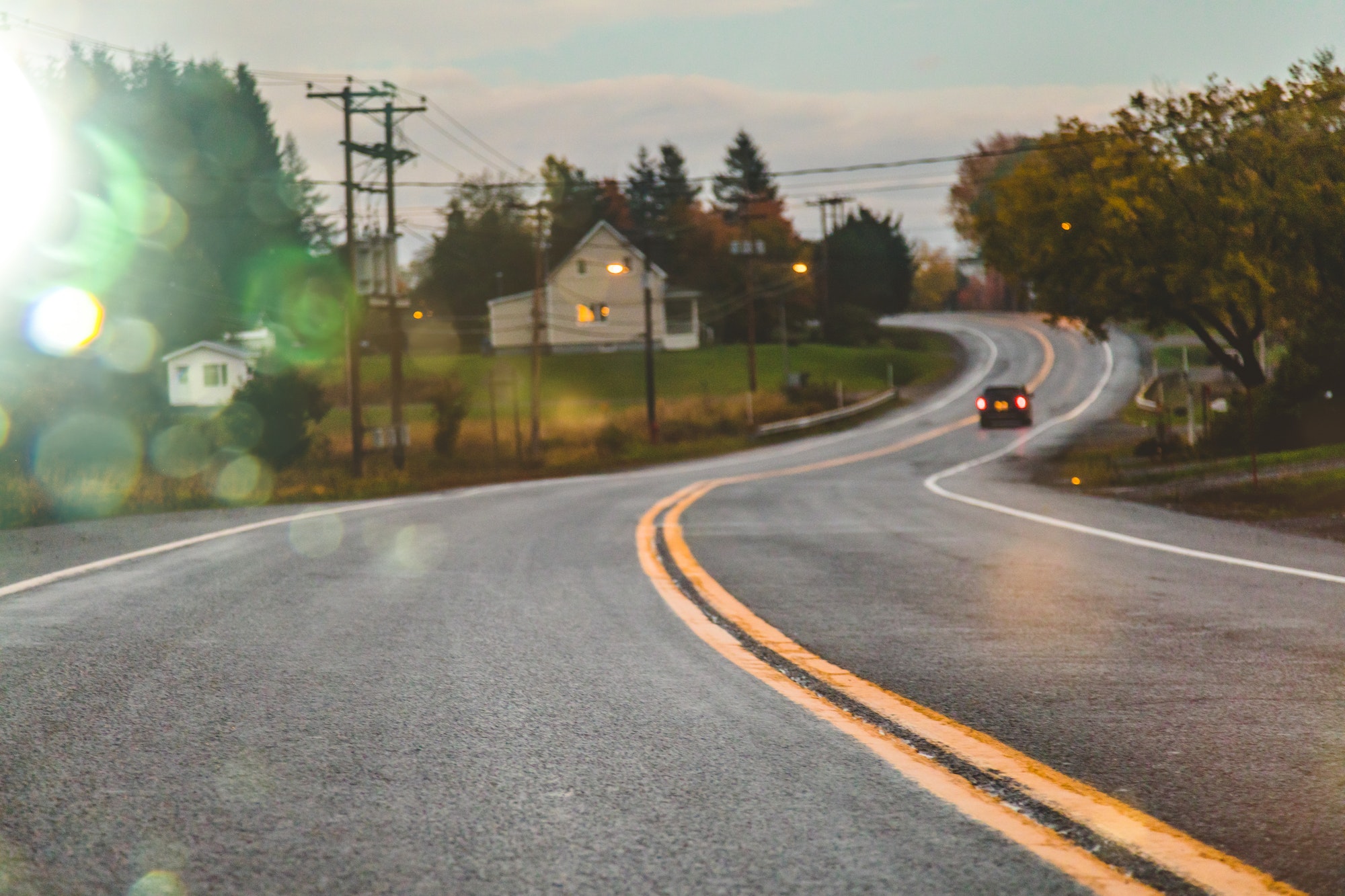 Car driving on road in evening Car driving on road in evening