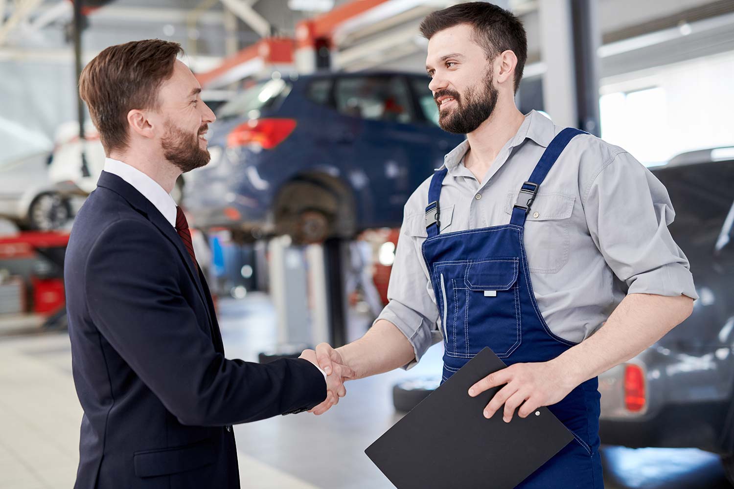 mechanic-shaking-hands-with-businessman-small.jpg mechanic-shaking-hands-with-businessman-small.jpg
